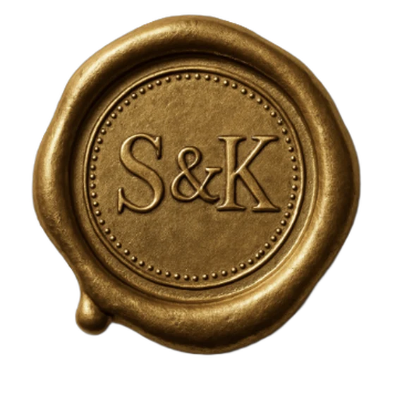 A antique gold wax seal with the initials S & K, designed in the Seal Studio